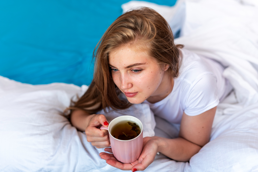 Person Lying Awake In Bed After Drinking Coffee Late